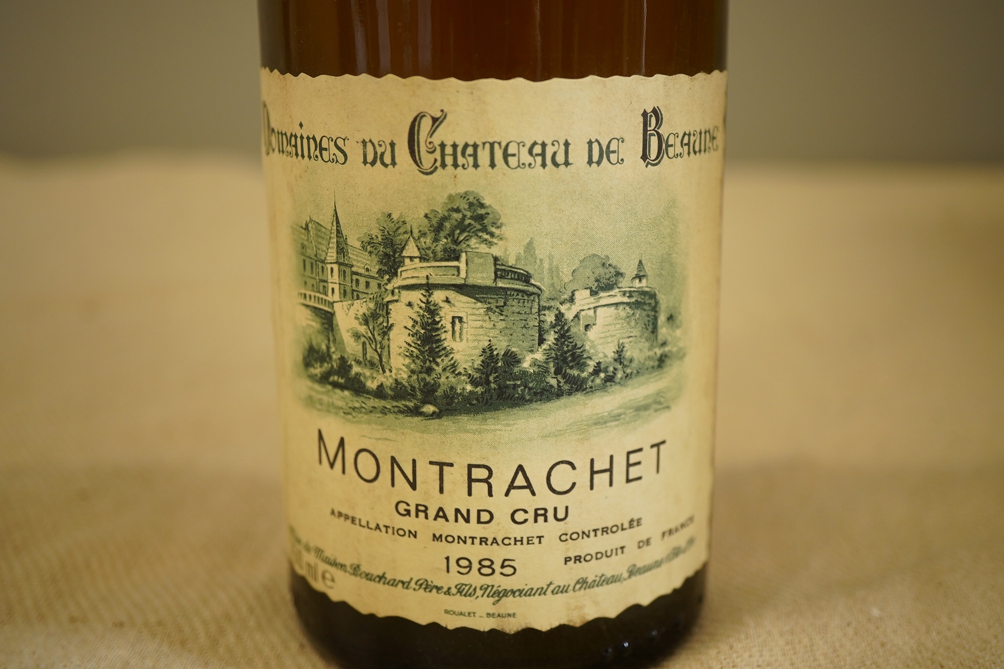 One bottle of 1985 Montrachet Grand Cru, Domaines du Chateau de Beaune.